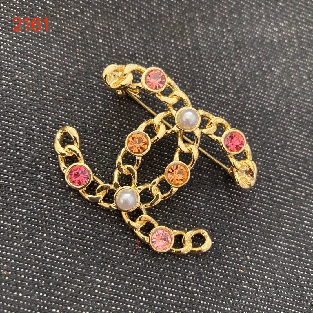 Studded letter tassel brooch